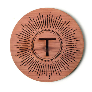 Coaster, Letter T and starburst design on cedar wood