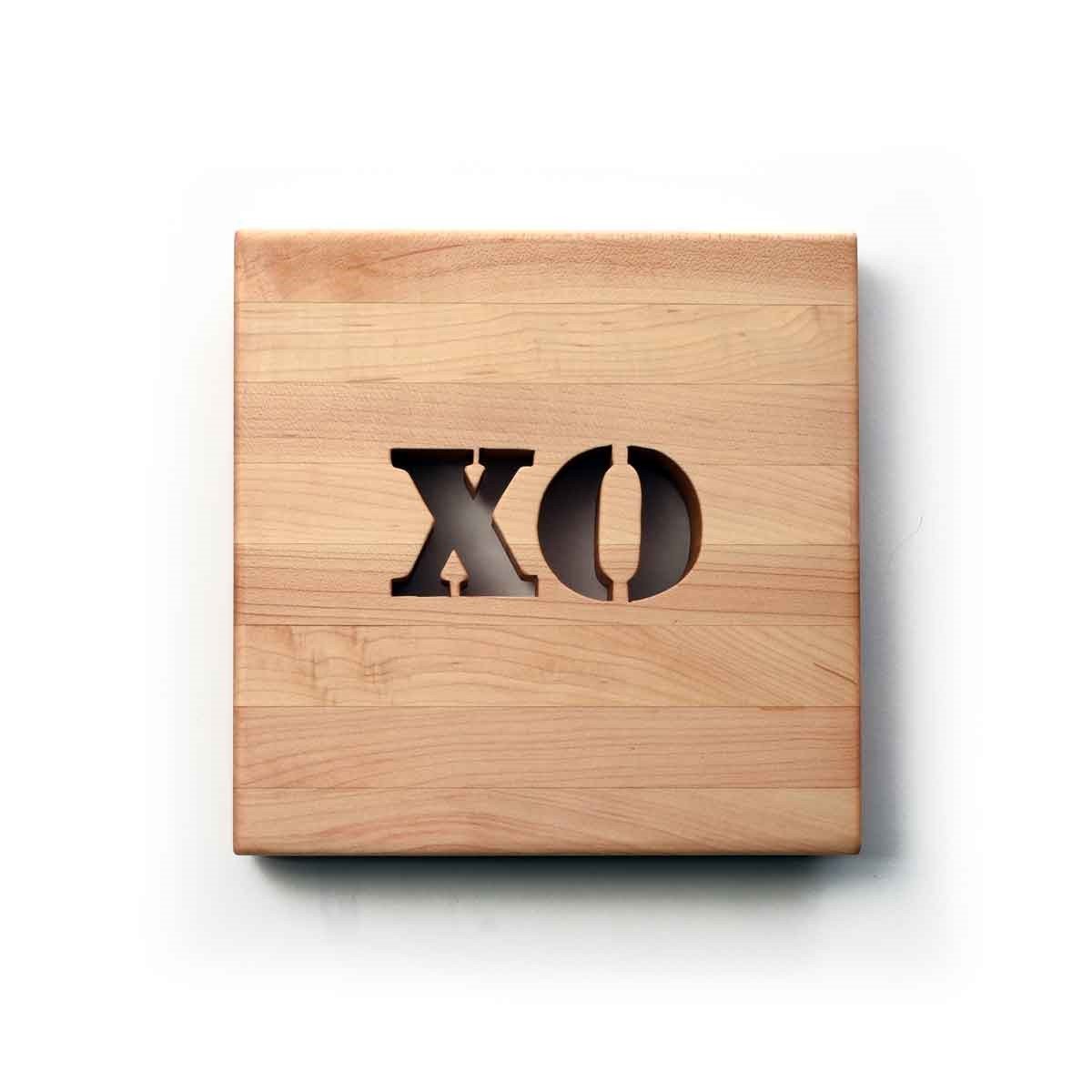 wooden trivet, letters XO cut out