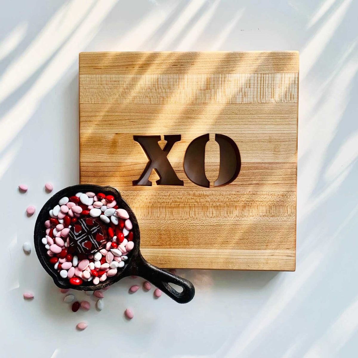 wooden trivet, letters XO cut out