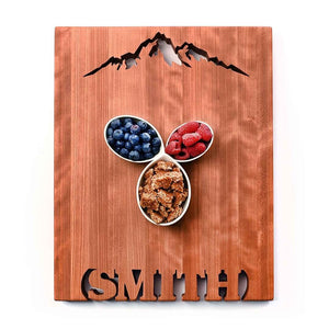large personalized cherry cutting board, mountains and names cut out of wood