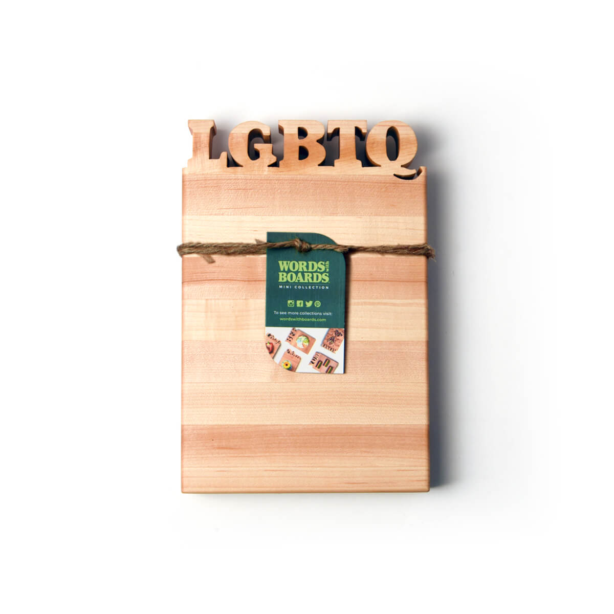 LGBTQ letters cut out of wooden cutting board