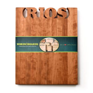 large personalized wooden cutting board, names carved out of cherry wood