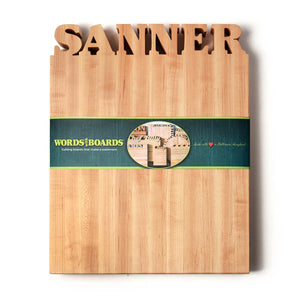 large personalized wooden cutting board, names carved out