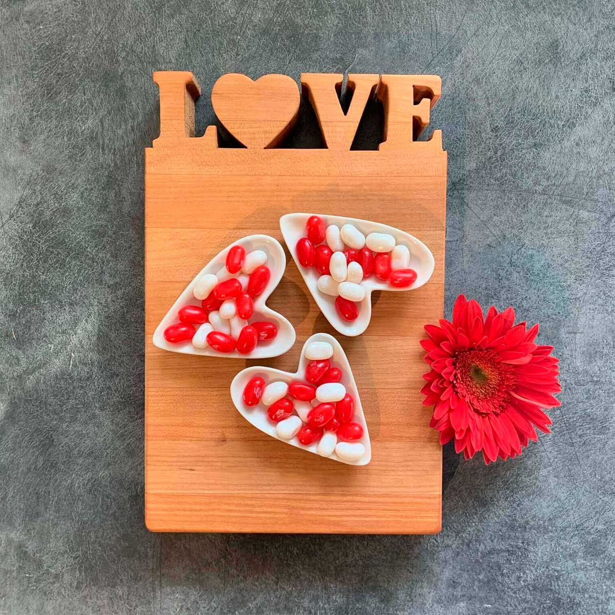 Love Cutting board with candy on it
