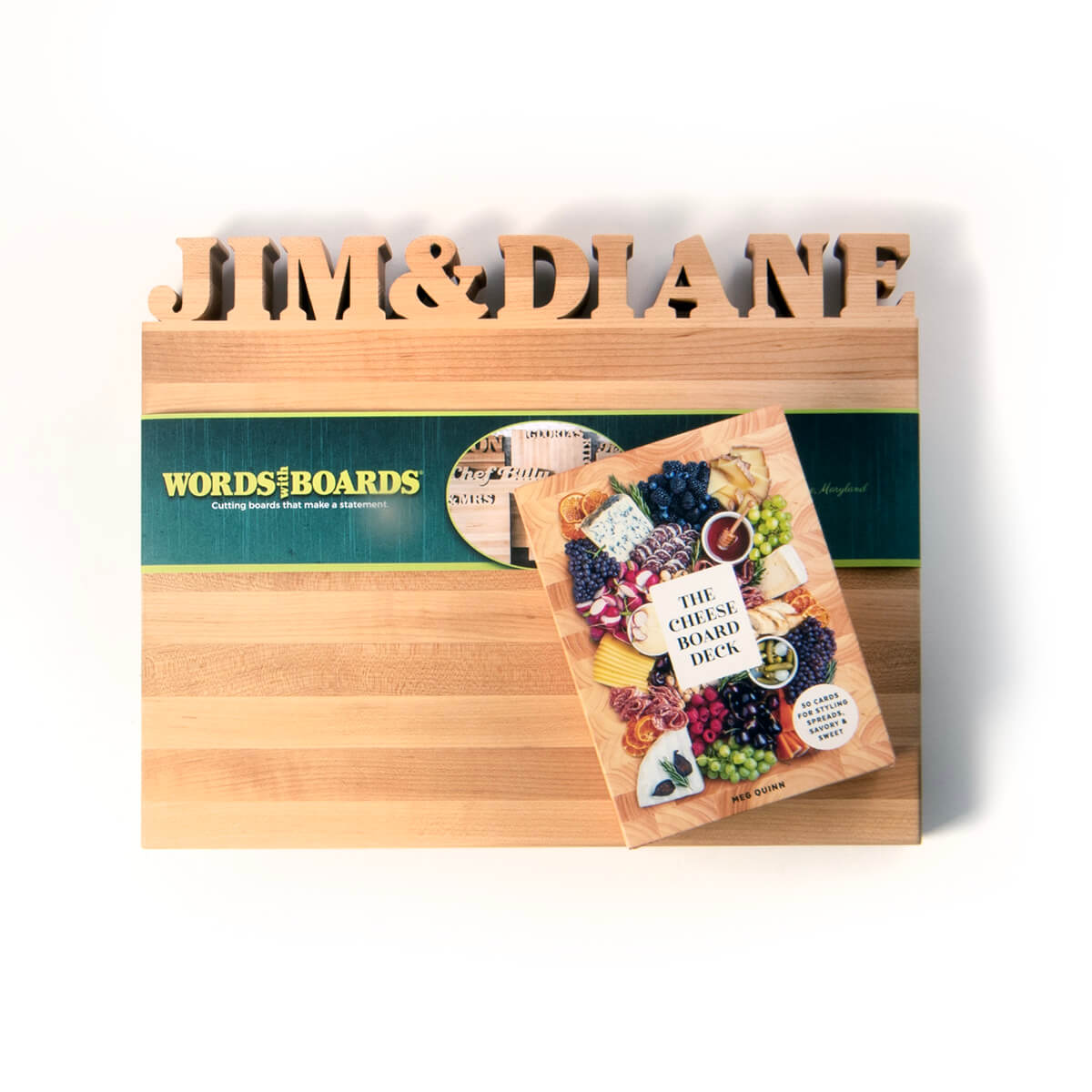 the cheese board deck, shown on maple cutting board with names cut out